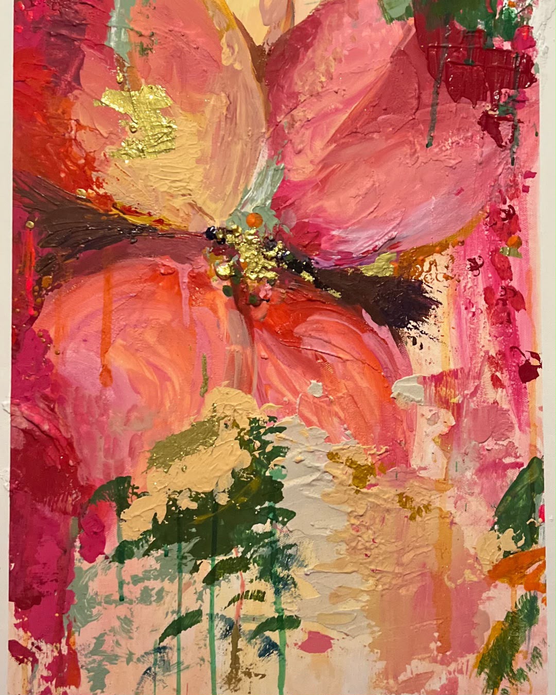 Hands mid-brushstroke, working with paint